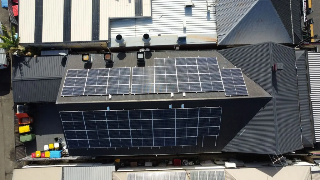 Industrial solar panel installation at a large commercial facility with high-efficiency industrial solar panels and a complete industrial solar system by Scope Solar.